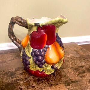 Beautiful pitcher with fruit accents